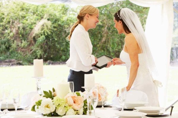 wedding planner talking to bride