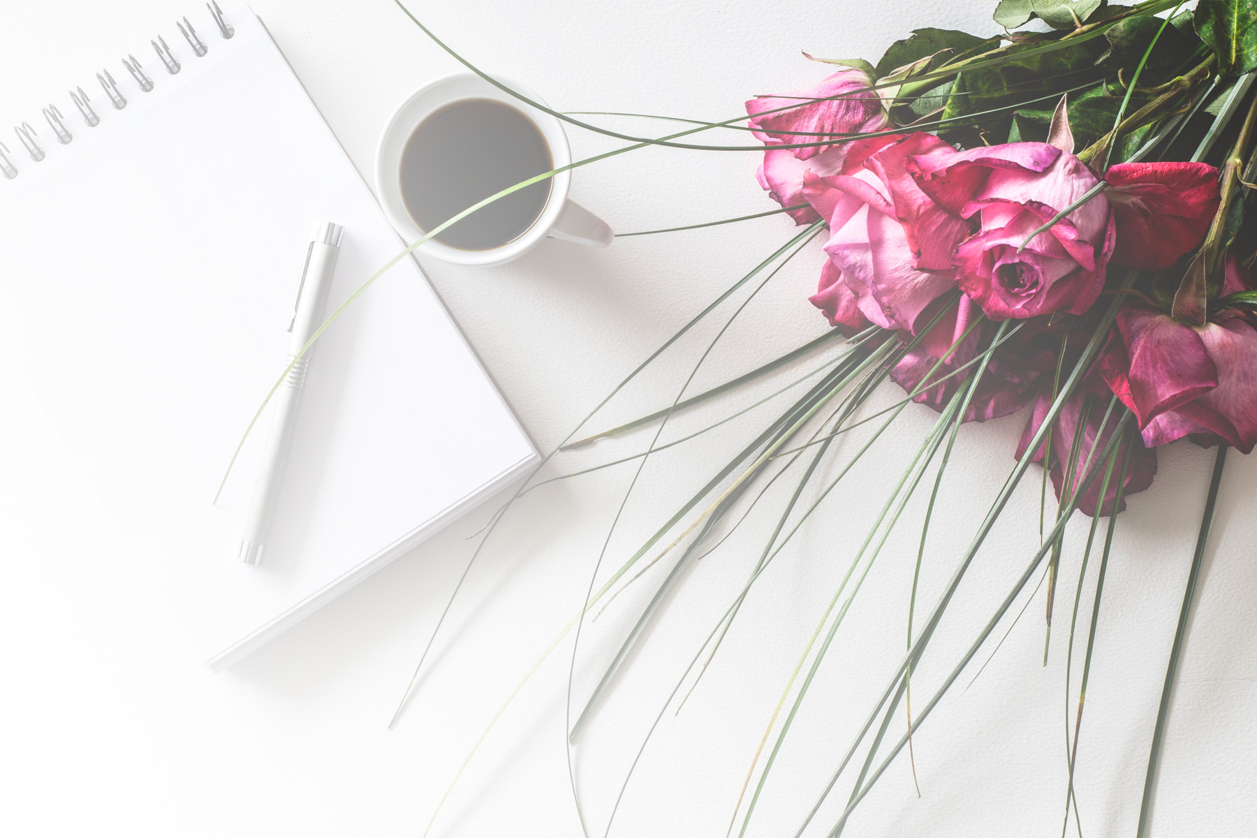 Notepad and rose bouquet