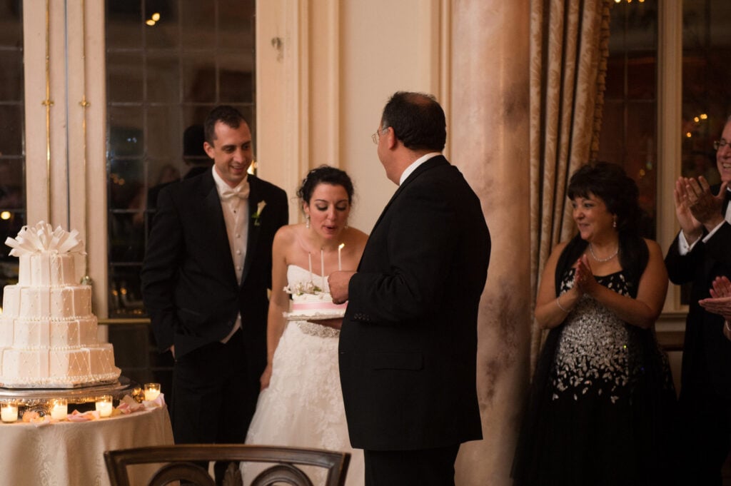 blowing out candles at a reception