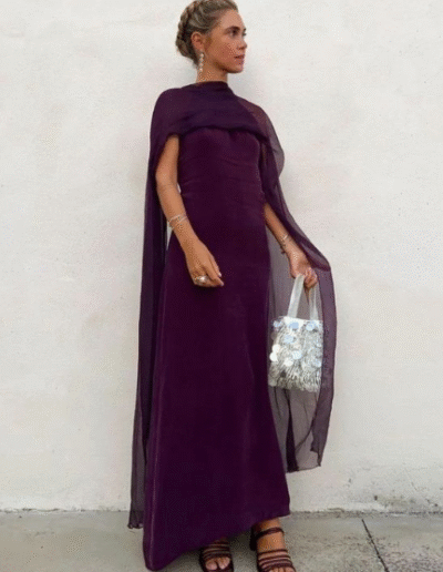A woman in a long dress. The image is pixelated.